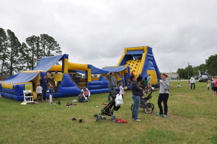 Service members and their families enjoy the food and outdoor activities at the Joint Base Charleston Picnic May 4, 2013. The base picnic was a free two-day event which included free food, drinks and a live band for all Team Charleston members and their families to enjoy. (U.S. Air Force photo/Senior Airman Bobby Pilch)