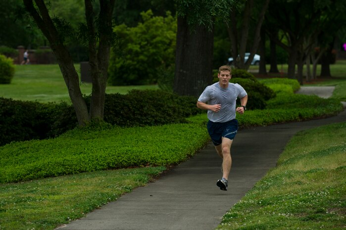 Senior Airman Matthew Knopf, 628th Medical Group health service  management technician, pushes towards the finish line during the Commander’s Challenge Run May 3, 2013, at Joint Base Charleston – Air Base, S.C. The Commander's Challenge is held monthly to test Team Charleston's fitness abilities. Knopf was the top male runner with a time of 18:57. (U.S. Air Force photo/ Senior Airman George Goslin)