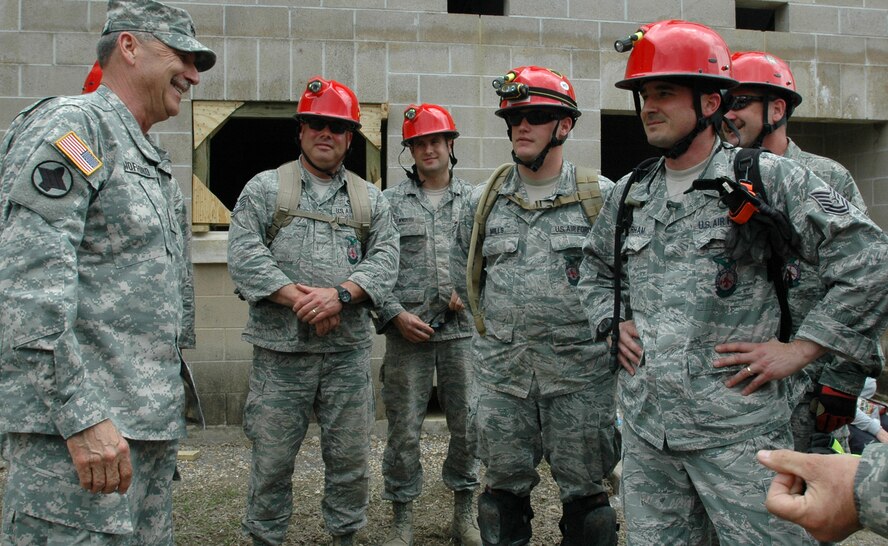 Maj. Gen. William Wofford, Arkansas National Guard adjutant general, visits with members of the 188th Civil Engineering Squadron during Vigilant Guard Arkansas 2013, at Camp Gruber, Okla., April 17, 2013. (U. S. Army National Guard photo by Spc. Elizabeth Pena)