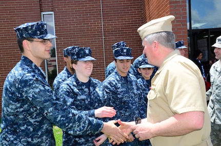 Navy Capt. Tom Bailey, Joint Base Charleston deputy commander, thanks Sailors for their support during the Weapons Station Branch Library move May 7, 2013, at Joint Base Charleston – Weapons Station, S.C.  Twenty-five Sailors helped move books, furniture and equipment from the library, saving the 628th Air Base Wing more than $90,000. (U.S. Air Force photo/Staff Sgt. Anthony Hyatt)