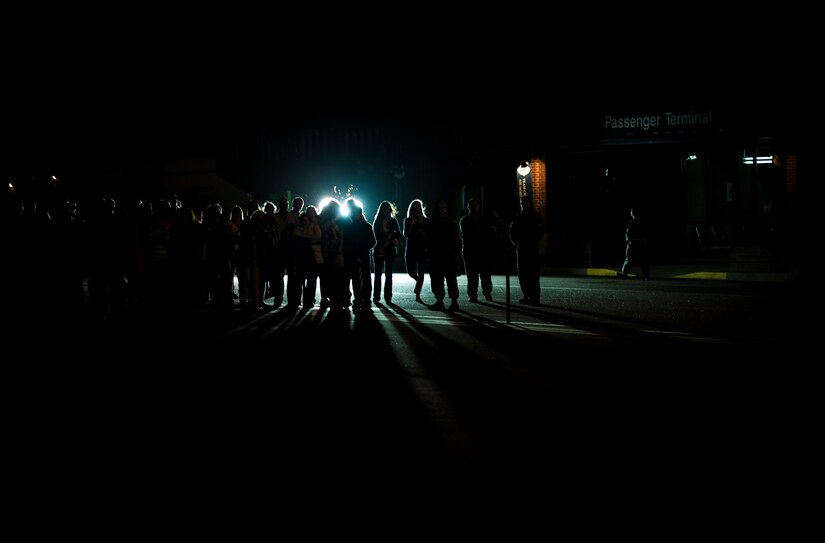 Family members of Airmen from the 15th Airlift Squadron wait in front of the 437th Airlift Wing Passenger Terminal for their significant others to return home May 4, 2013, at Joint Base Charleston – Air Base, S.C. The squadron flew 1,000 sorties while safely moving 40 million pounds of cargo and 5,000 passengers throughout the area of responsibility. The squadron also precisely executed 33 combat airdrops resupplying forward operating bases throughout Southwest Asia with 900 bundles of supplies. (U.S. Air Force photo/ Senior Airman Dennis Sloan)