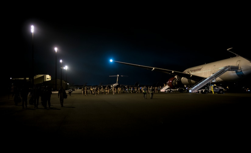 Airmen from the 15th Airlift Squadron return from a two-month deployment to Southwest Asia, May 4, 2013, at Joint Base Charleston – Air Base, S.C. The squadron flew 1,000 sorties while safely moving 40 million pounds of cargo and 5,000 passengers throughout the area of responsibility. The squadron also precisely executed 33 combat airdrops resupplying forward operating bases throughout Southwest Asia with 900 bundles of supplies. (U.S. Air Force photo/ Senior Airman Dennis Sloan)