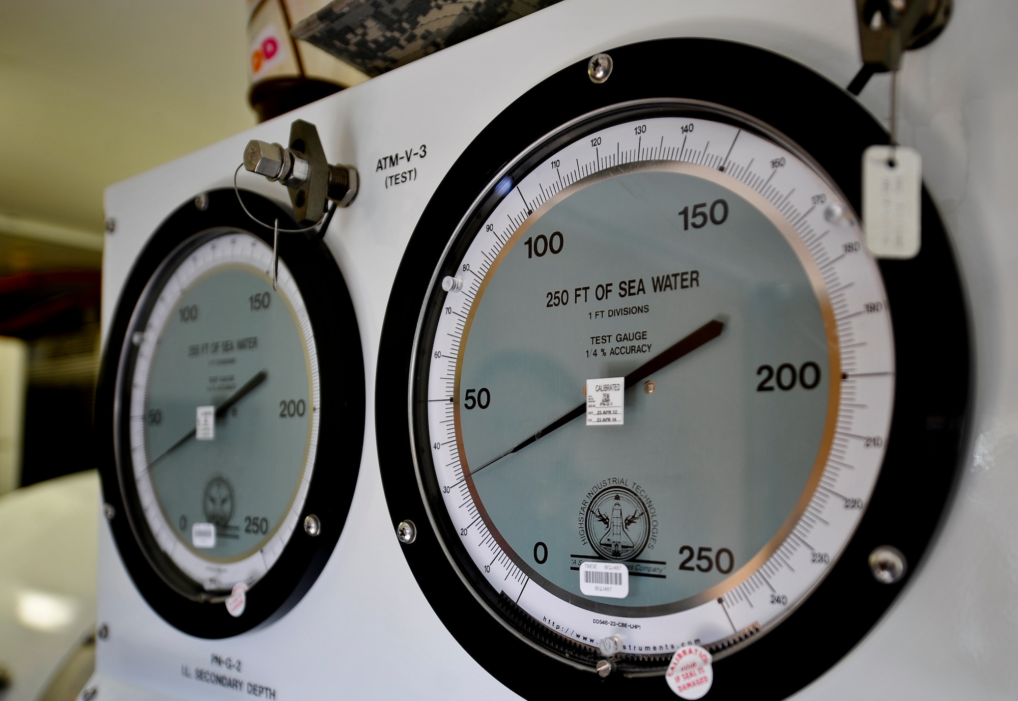 Gauges show the current pressure inside the hyperbaric chamber during a training event involving Fort Eustis divers and local community search and rescue teams at Fort Eustis, May 2, 2013. The training was for divers and medical personnel from both local and federal search and rescue dive teams, and instructed personnel on basic dive first aid, known as "tender maneuvers." (U.S. Air Force photo by Staff Sgt. Wesley Farnsworth/Released)