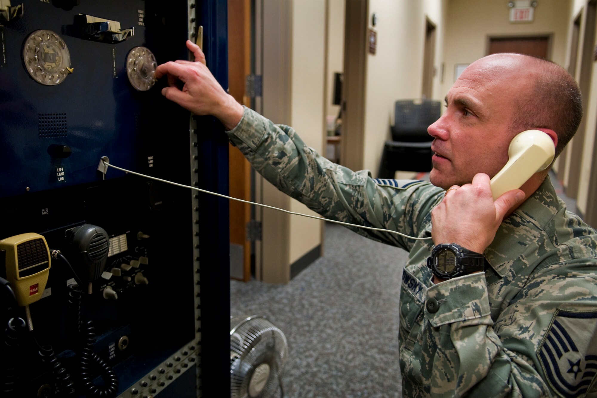 GRISSOM AIR RESERVE BASE, Ind. -- Master Sgt. Craig Petrowsky, 434th Air Refueling Wing command post training manager, operates an electromagnetic pulse hardened communications device here April 14. Grissom command post controllers use a myriad of high-tech equipment, which provide secure communications that allow command and control functions to continue in the event of a major disaster that could hinder communications. (U.S. Air Force photo/Tech. Sgt. Mark R. W. Orders-Woempner)
