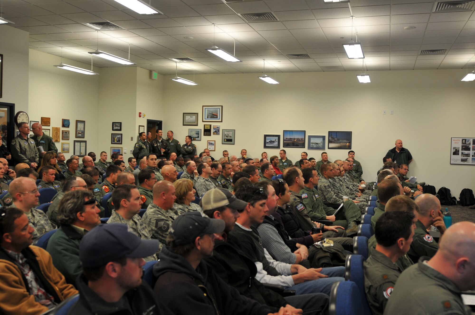 U.S. Air Force Col. Steve Rader, commander of the 153rd Airlift Wing, Wyoming Air National Guard, welcomes members from the 145th Airlift Wing, North Carolina Air National Guard and representatives from 302nd Airlift Wing and 146th Airlift Wing at the beginning of the annual Modular Airborne Fire Fighting System training for certification held at the Cheyenne Regional Airport, Cheyenne, Wyo., May 6, 2013. (U.S. Air National Guard photo by Tech. Sgt. Patricia Findley/Released)
