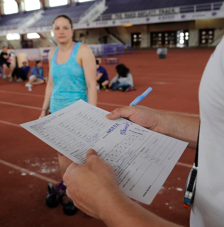 Staff Sgt. Samantha Scott, 509th Bomb Wing Command Post training manager, prepares to start the third event—kettle bell squat clean-thrusters, box jumping, 800-meter run and the deadlift—during the K-State CrossFit Challenge in Manhattan, Kan., April 27, 2013.  This was Scott’s first local competition and placed third overall in the women’s scaled division. (U.S. Air Force photo by Staff Sgt. Alexandra M. Boutte/Released)