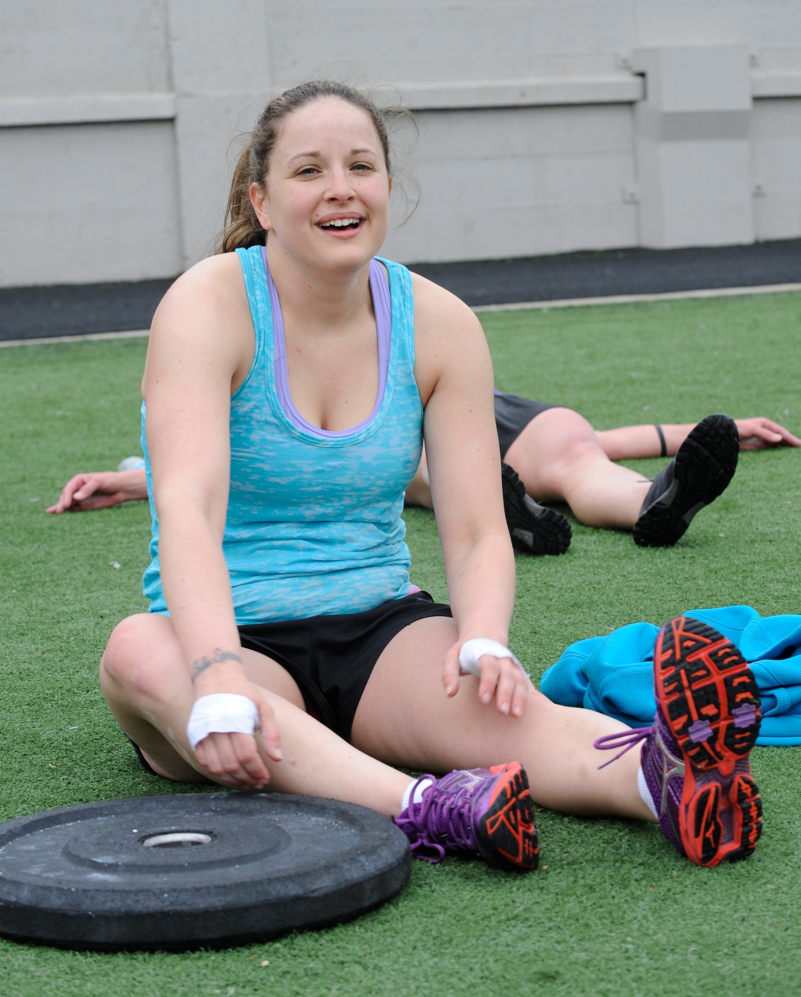 Staff Sgt. Samantha Scott, 509th Bomb Wing Command Post training manager, takes a breather after finishing her second event—stair running and burpees—during the K-State CrossFit Challenge in Manhattan, Kan., April 27, 2013.  She placed third overall in the woman’s scaled division.  (U.S. Air Force photo by Staff Sgt. Alexandra M. Boutte/Released)