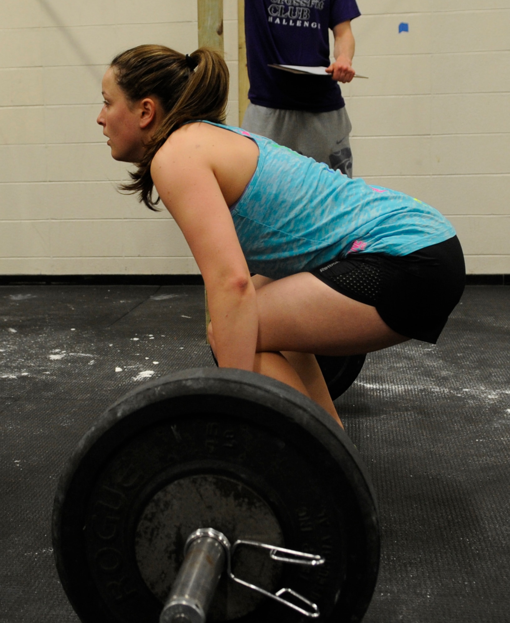 Staff Sgt. Samantha Scott, 509th Bomb Wing Command Post training manager, performs deadlifts at the K-State CrossFit Challenge in Manhattan, Kan., April 27, 2013.  The first event included the deadlifts and chest-to-bar pull ups. (U.S. Air Force photo by Staff Sgt. Alexandra M. Boutte/Released)