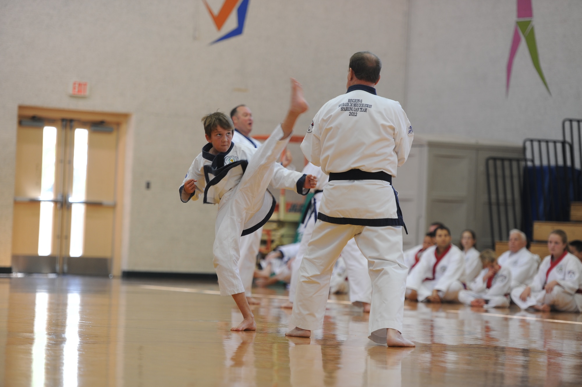Thomas Gale performs a kicking demonstration at Vance Air Force Base, Okla., in the gymnasium May 4 during an evaluation to attain the rank of e dan, a 2nd degree black belt in Soo Bakh Doo. The martial arts students and teachers, part of Soo Bahk Doo Region 6, were participating in a Shim Sa, or an evaluation for promotion to the next belt or rank. Shim Sa's are held during the spring and fall, and this was the first time a Shim Sa for black belts was held on an military installation in the continental U.S. (U.S. Air Force photo/Senior Airman Frank Casciotta)