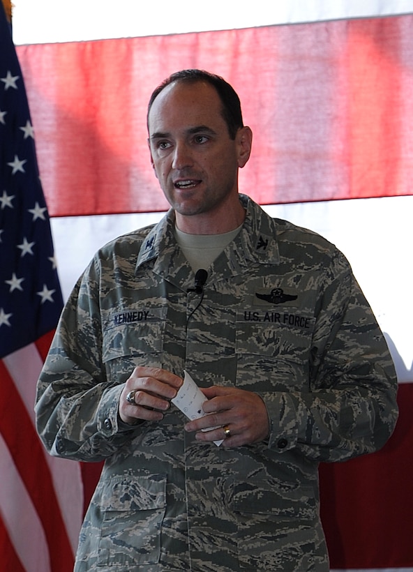 Col. Kevin Kennedy, 28th Bomb Wing commander, shares a few details about his life and career with Airmen during a commander's call in the Pride Hangar at Ellsworth Air Force Base, S.D., May 2, 2013. Kennedy gathered Ellsworth Airmen together to outline his priorities as commander – “win the fight, strengthen the team and prepare for the future.” (U.S. Air Force photo by Airman 1st Class Hrair H. Palyan/Released)