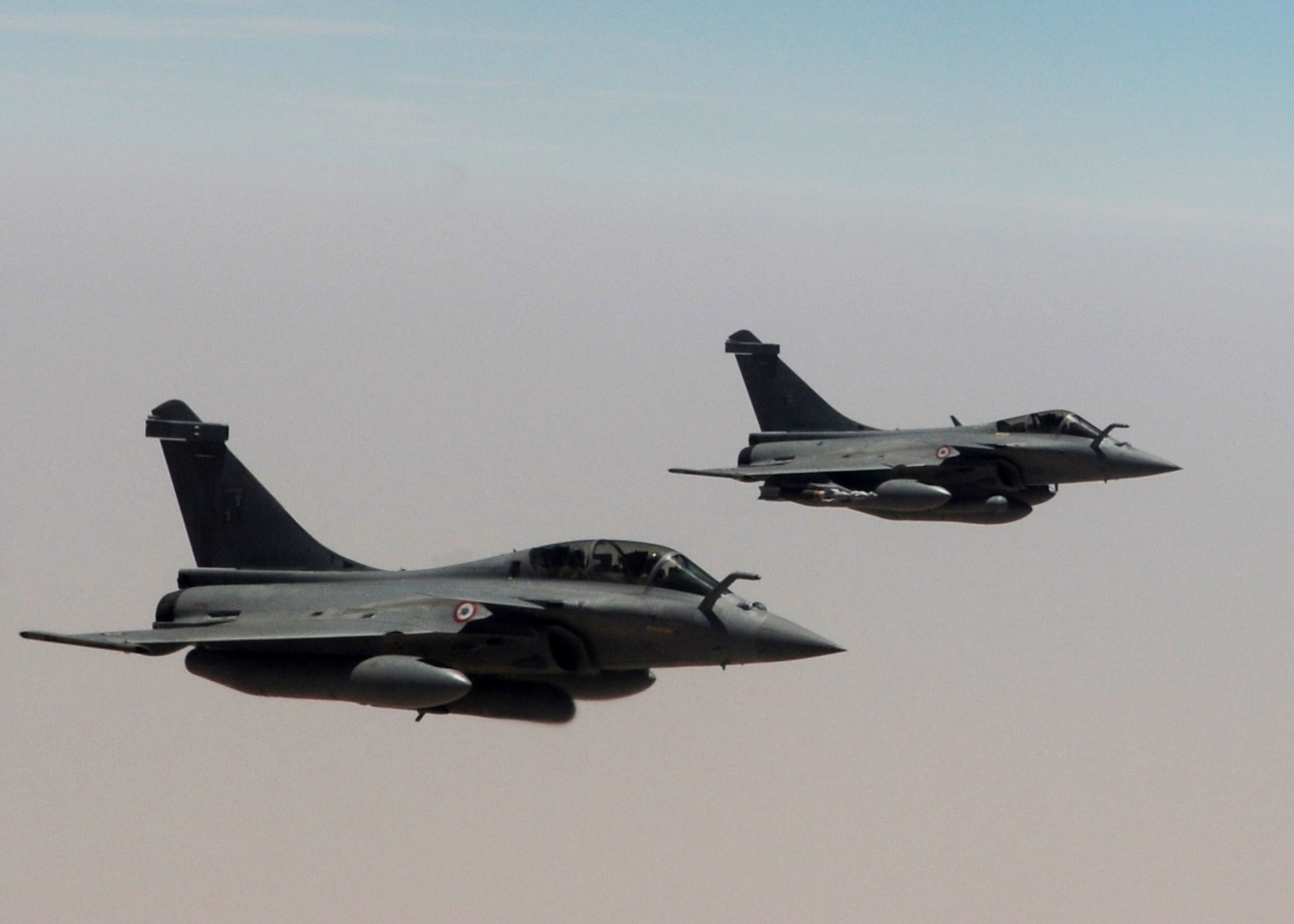 Two French Rafales prepare to take on fuel from a KC-135R Stratotanker deployed with the 351st Expeditionary Air Refueling Squadron May 3, 2013, over Mali. The French fighter aircraft have been refueled more than 1,000 times over 200 missions by the 351st EARS May 5, 2013, in support of the French-led operations. (U.S. Air Force photo by 1st Lt. Christopher Mesnard/Released)