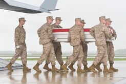 A U.S. Marine Corps carry team transfers the remains of Marine Cpl. David M. Sonka of Parker, Colo., at Dover Air Force Base, Del., May 7, 2013. Sonka was assigned to 2nd Marine Special Operations Battalion, Camp Lejeune, N.C. (U.S. Air Force photo/Roland Balik)