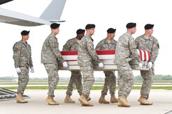 A U.S. Army carry team transfers the remains of Army Staff Sgt. Francis G. Phillips IV of Meridian, N.Y., at Dover Air Force Base, Del., May 7, 2013. Phillips was assigned to the 1st Battalion, 36th Infantry, 1st Brigade Combat Team, 1st Armored Division, Fort Bliss, Texas. (U.S. Air Force photo/Roland Balik)