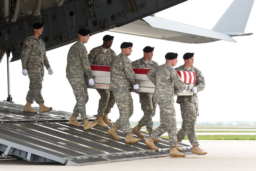 A U.S. Army carry team transfers the remains of Army 1st Lt. Brandon J. Landrum of Lawton, Okla., at Dover Air Force Base, Del., May 7, 2013. Landrum was assigned to the 1st Battalion, 36th Infantry, 1st Brigade Combat Team, 1st Armored Division, Fort Bliss, Texas. (U.S. Air Force photo/Roland Balik)