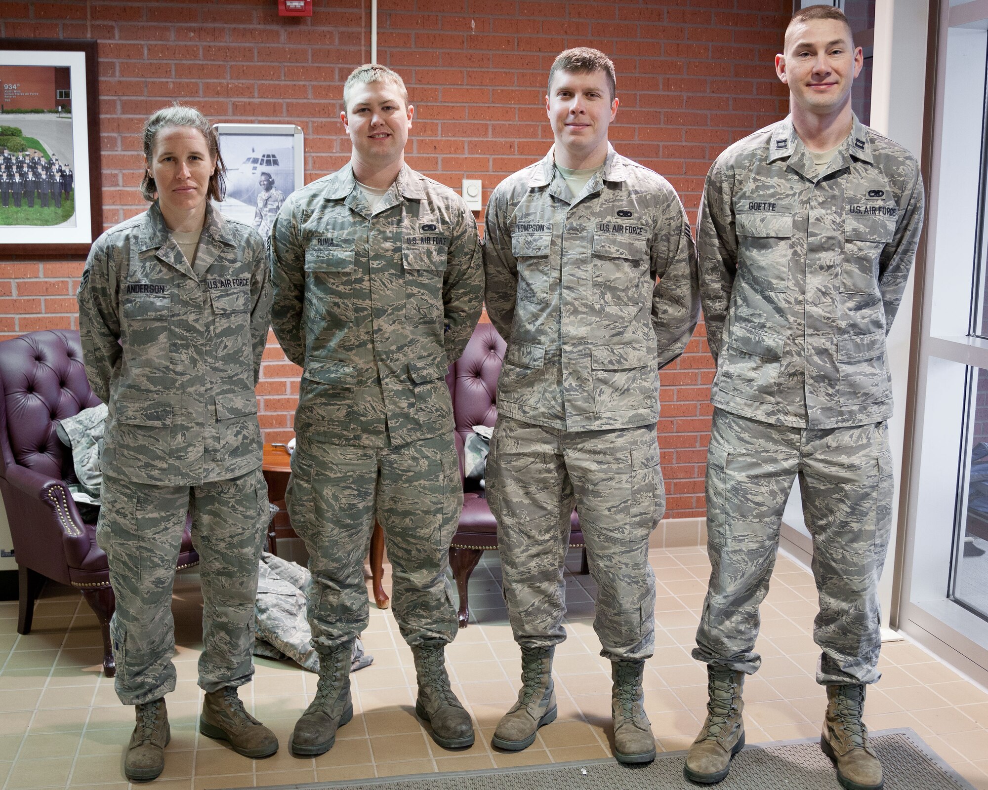 (Right to left) Capt. Lance Goette, and Senior Airmen Christoper Thompson, Trent Runia, and Sara Anderson, 934th Maintenance Squadron, perform the flag ceremonies throughout the May Unit Training Assembly weekend at the Minneapolis-St. Paul Air Reserve Station, Minn. (U.S. Air Force photo/Shannon McKay)