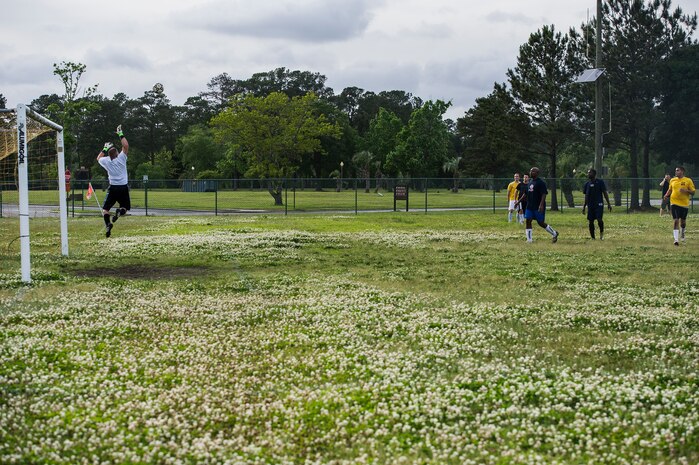 628th Senior Airman Derek Kasper, 628th Logistics Readiness Squadron intramural soccer team goalkeeper jumps in the air to defend a goal May 2, 2013, at Joint Base Charleston – Air Base, S.C. The 628th LRS soccer team defeated the 437th APS soccer team 8 – 2 in Joint Base Charleston’s 2013 intramural soccer championship game. (U.S. Air Force photo/Staff Sgt. Rasheen Douglas)