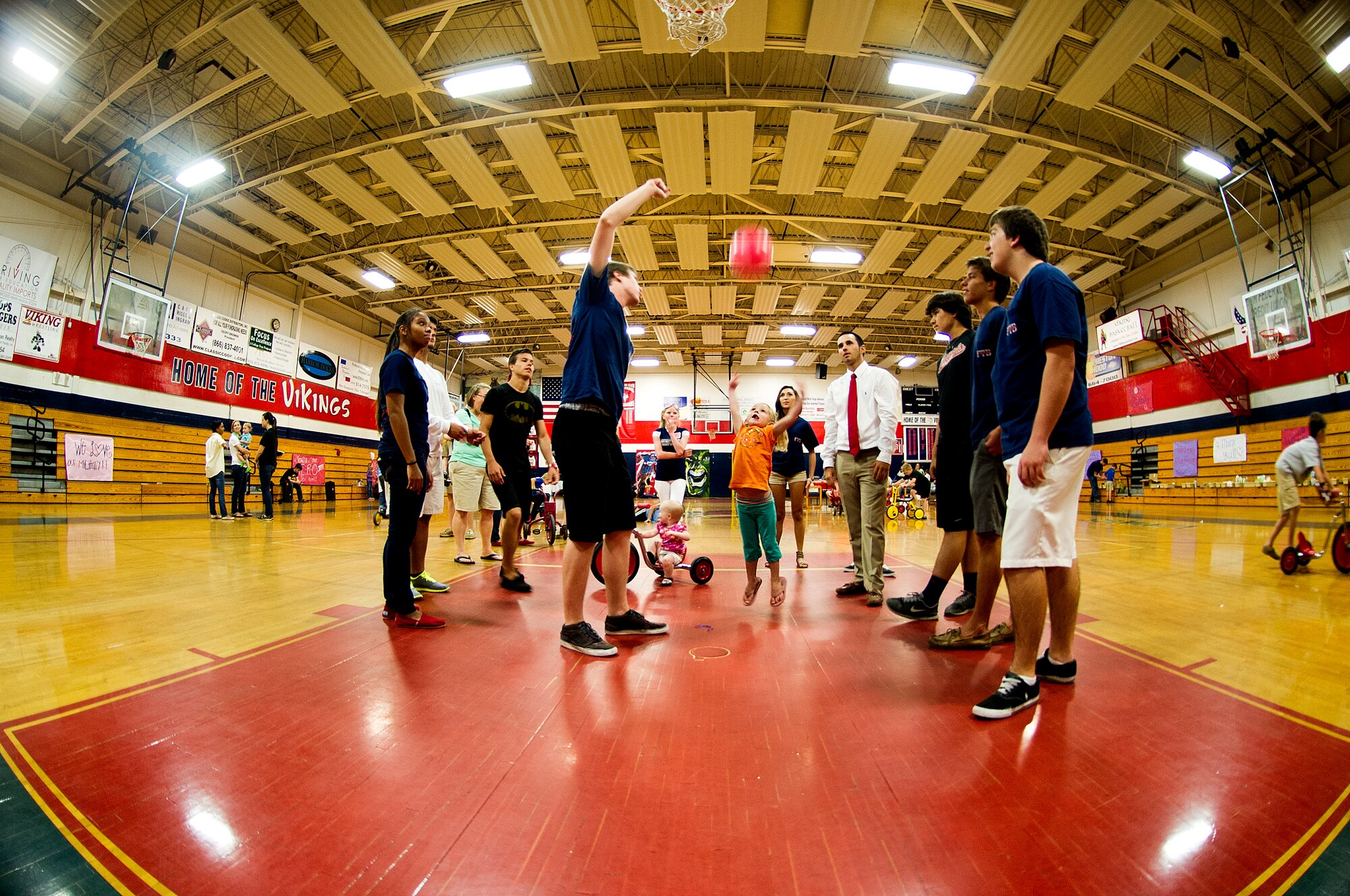 Haleigh, daughter of Amanda Weber, tosses a ball towards a basketball hoop at a “see you soon” event held by the Military Child Education Coalition Student 2 Student program at Fort Walton Beach High School gymnasium, Fort Walton Beach, Fla., May 2, 2013. The S2S program trains military-connected high school students to create a peer-based program in their school to support the many transitions of military children. (U.S. Air Force photo/Airman 1st Class Christopher Callaway) 