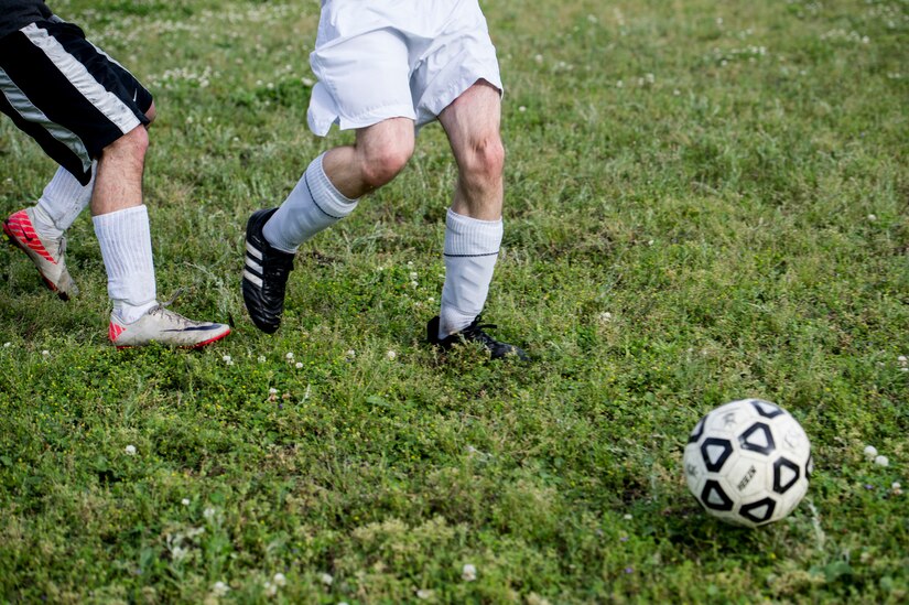 Members from the 628th Logistics Readiness Squadron and 437th Aerial Port Squadron race to the ball during the Intramural Soccer Championship May 2, 2013, at the Joint Base Charleston – Air Base, S.C. The 628th LRS soccer team defeated the 437th APS soccer team 8 – 2 in the championship game. (U.S. Air Force photo/Staff Sgt. Rasheen Douglas)