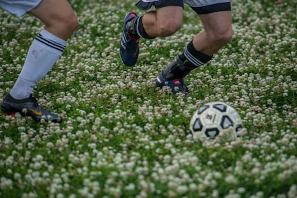 Members from the 628th Logistics Readiness Squadron and 437th Aerial Port Squadron race to the ball during the Intramural Soccer Championship May 2, 2013, at Joint Base Charleston – Air Base, S.C.. The 628th LRS soccer team defeated the 437th APS soccer team 8 – 2 in the championship game. (U.S. Air Force photo/Staff Sgt. Rasheen Douglas)