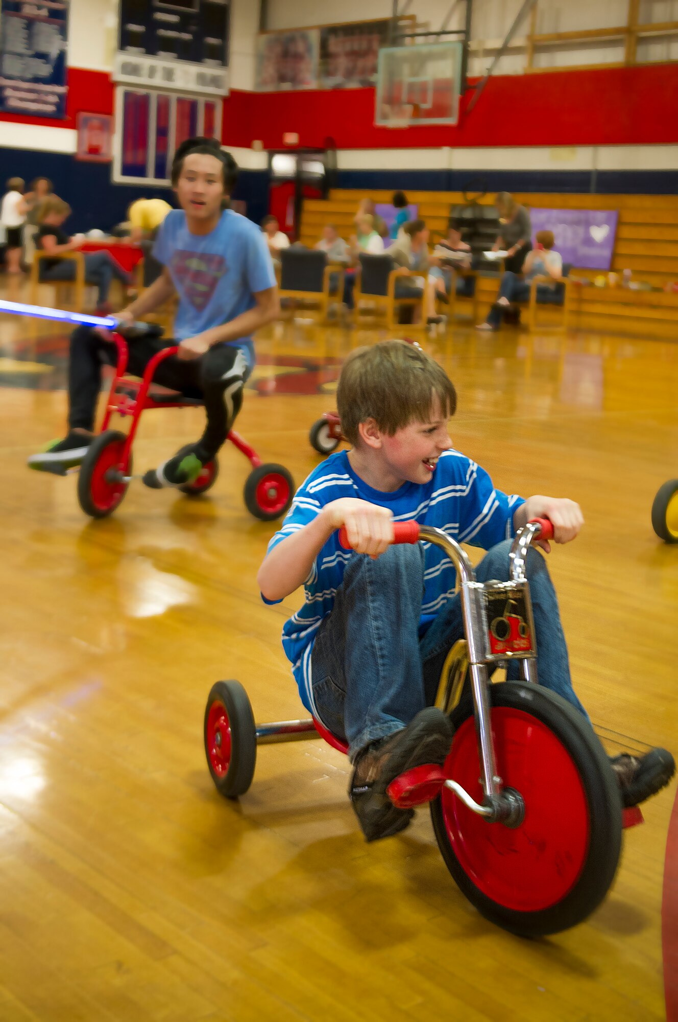 Reese, son of Kristy Durso, a Hurlburt Field Spouse is chased during a “See you Soon” event held by the Military Child Education Coalition’s Student 2 Student program at the Fort Walton Beach High School gymnasium at Fort Walton Beach, Fla., May 2, 2013. The S2S program trains military-connected high school students to create a peer-based program in their school to support the many transitions of military children.  (U.S. Air Force photo/Airman 1st Class Christopher Callaway)