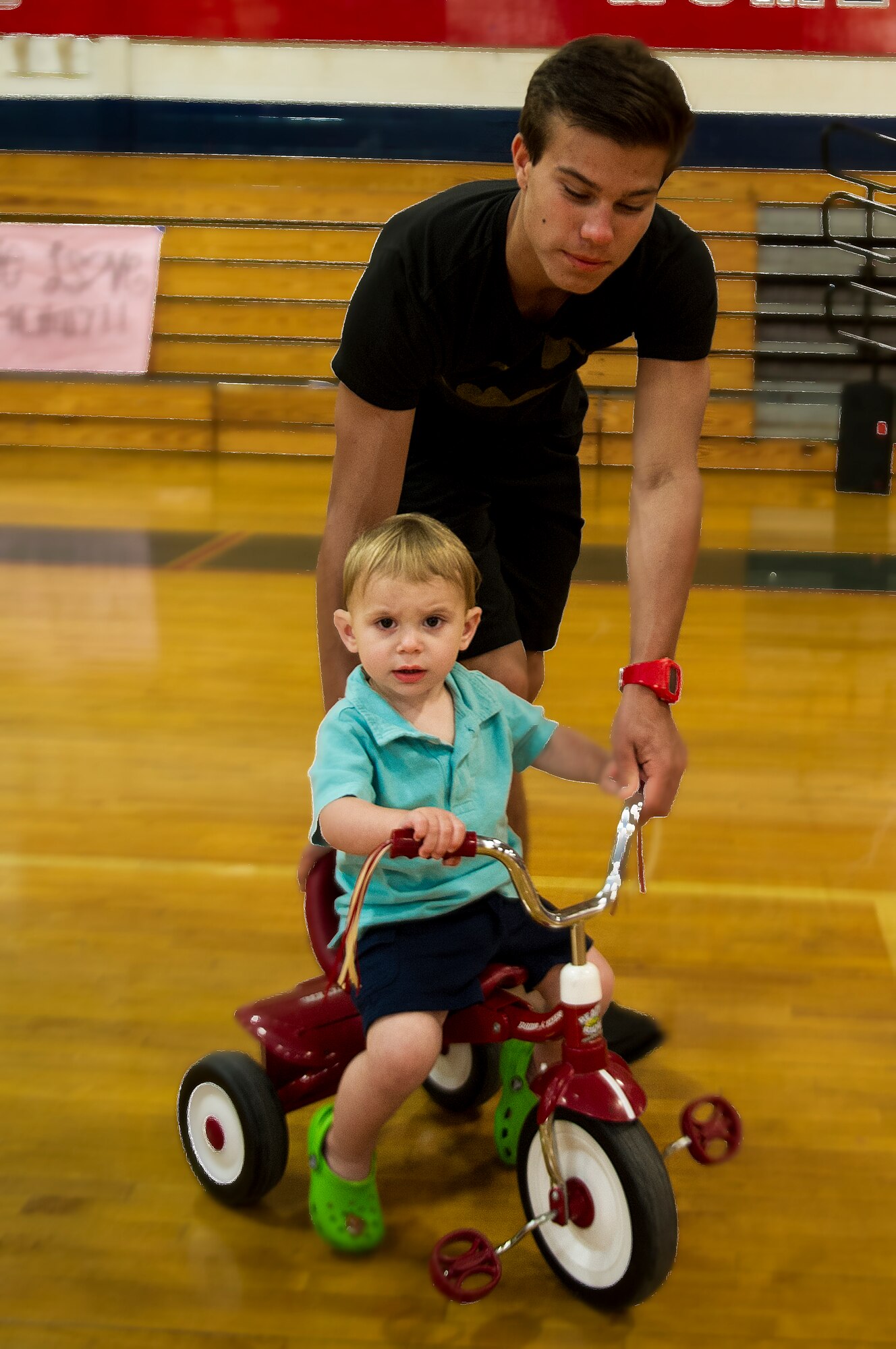 Jaxon, son of Amanda Weber is being pushed during a “See you Soon” event held by the Military Child Education Coalition’s Student 2 Student program at the Fort Walton Beach High School gymnasium at Fort Walton Beach, Fla., May 2, 2013. The event was a night to remember, with each child receiving their own teenager to assist them, packing mail out boxes, creating love bracelets, writing letters and taking pictures. (U.S. Air Force photo/Airman 1st Class Christopher Callaway)