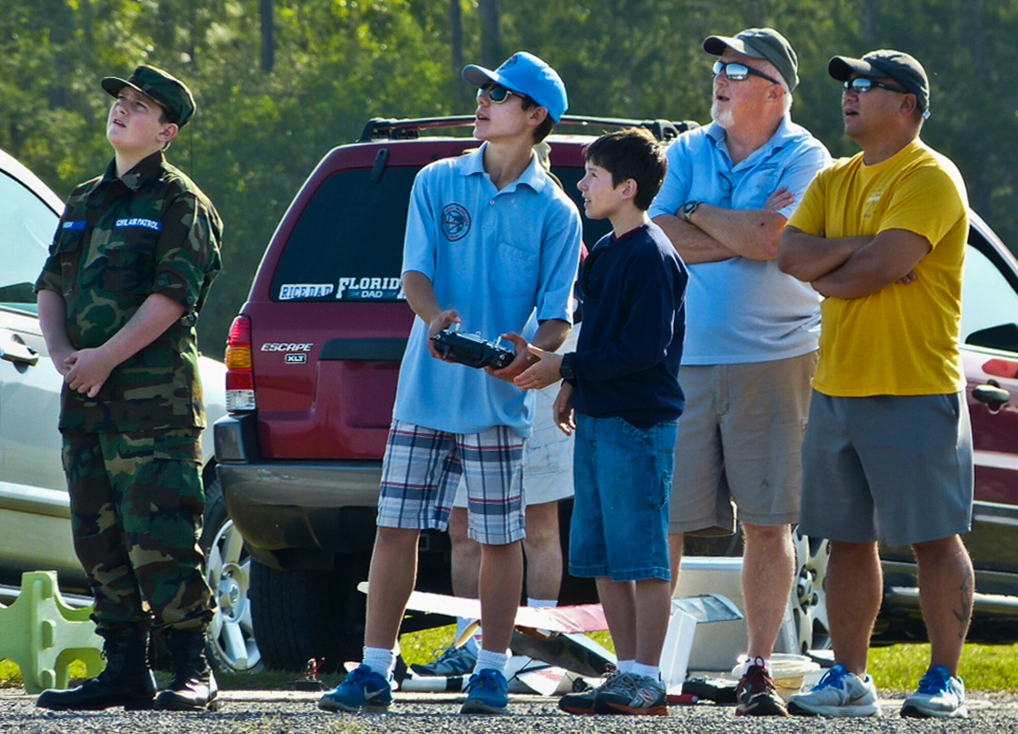 Cody Powell, the 13-year-old son of Maj. Jeff Powell, the 919th Maintenance Operations Flight commander, helps a fellow 'flyer' learn to maneuver an radio controlled aircraft April 27. Cody has won all but one of his 15 RC aircraft competitions since he and his father joined the hobby two years ago. (Courtesy photo)