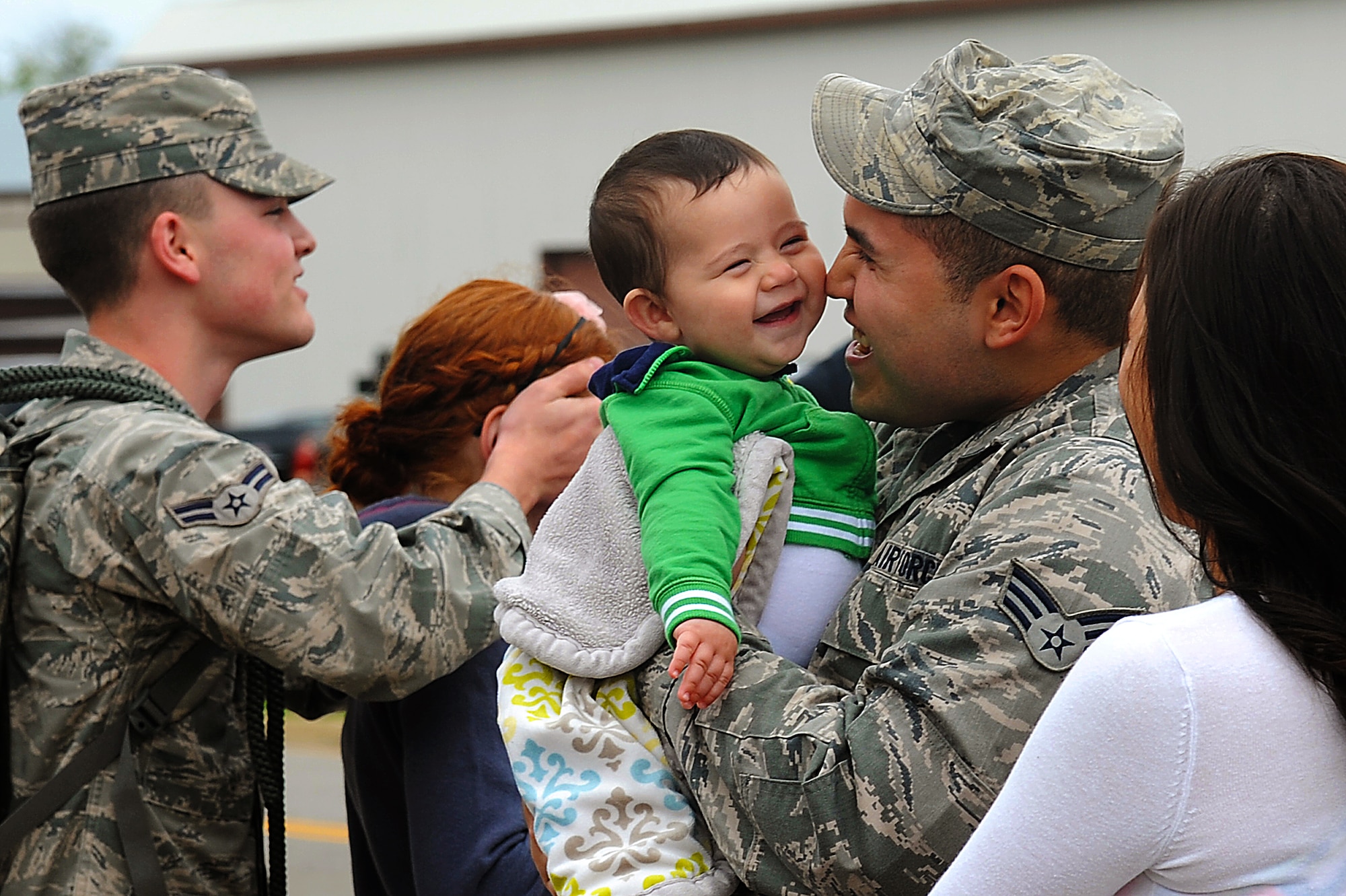 Airmen greet their family members after returning home from a five month deployment to Kadena Air Base, Japan. The deployment was in support of the U.S. Pacific Command’s security obligations in the Western Pacific. (U.S. Air Force photo by Airman 1st Class Victoria H. Taylor/Released)