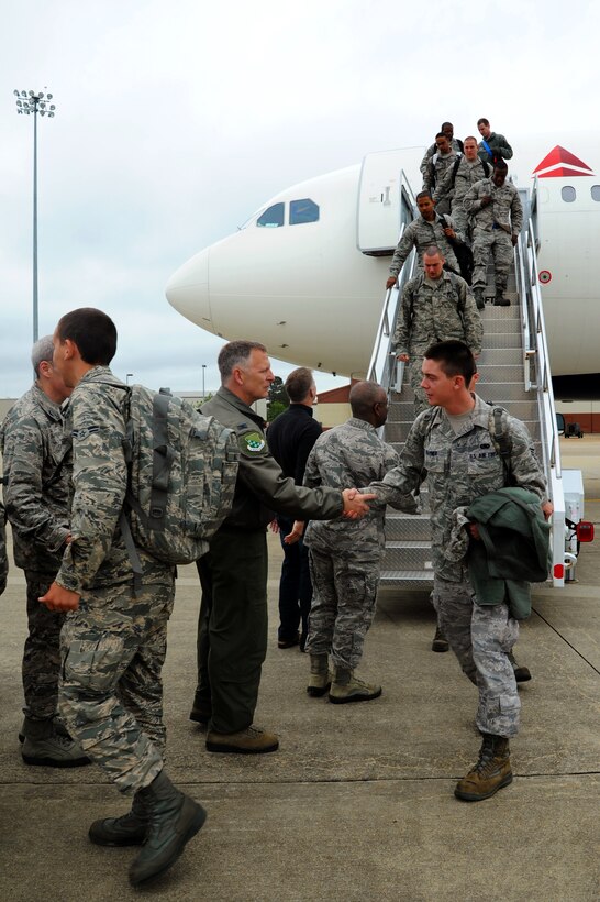 Airmen from the 1st Fighter Wing and the 192nd FW return home from a deployment to Kadena Air Base, Japan. Airmen from both units worked toward their mission of providing stability and security in the Asia-Pacific region. (U.S. Air Force photo by Airman 1st Class Victoria H. Taylor/Released)