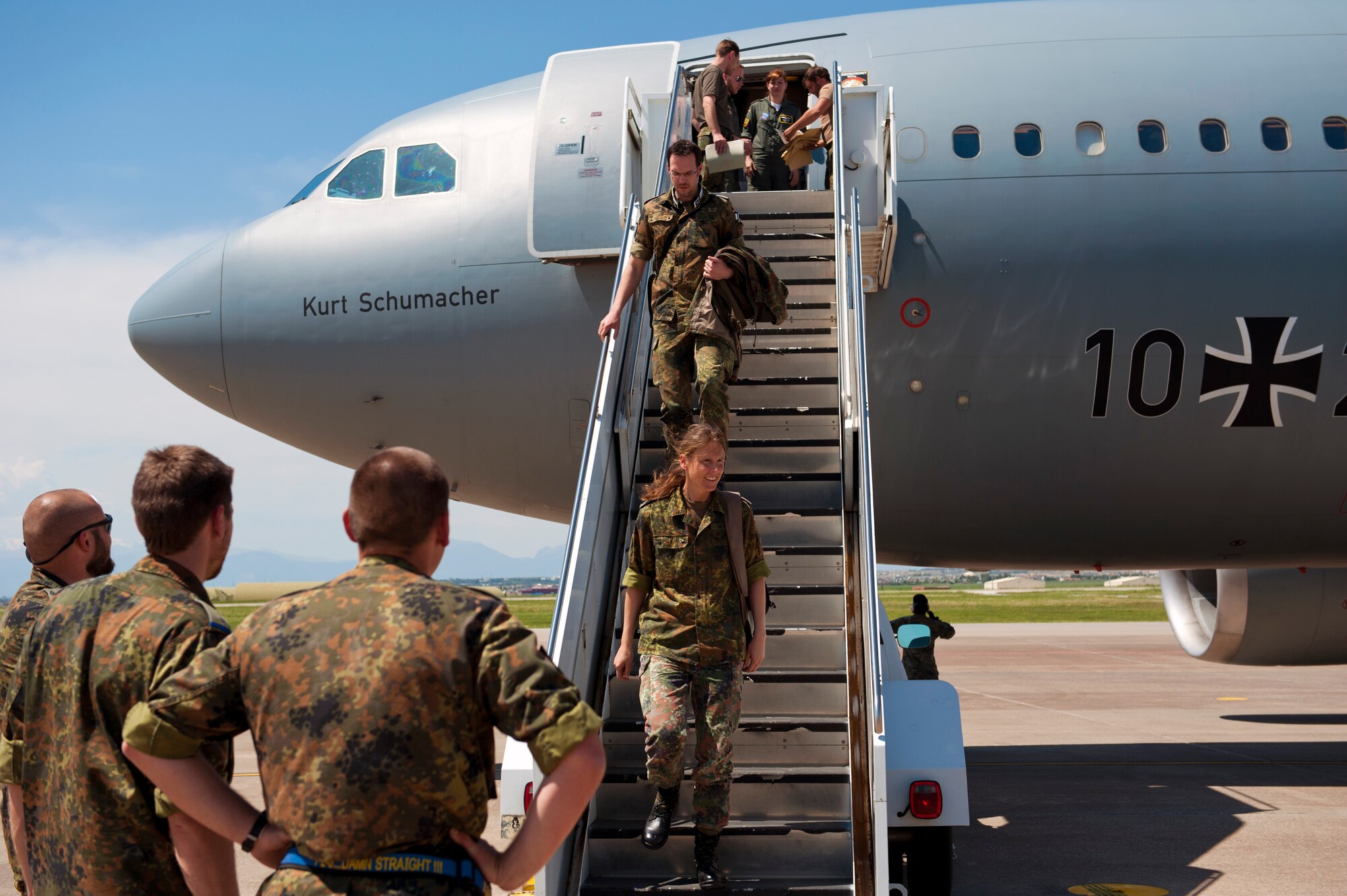 German soldiers disembark from a German A-310 air craft onto the Incirlik Air Base, Turkey flightline May 1, 2013. Their arrival marked the turnover for their NATO Patriot mission deployment to defend the Turkish-Syrian border. (U.S. Air Force photo by Senior Airman Daniel Phelps/Released)