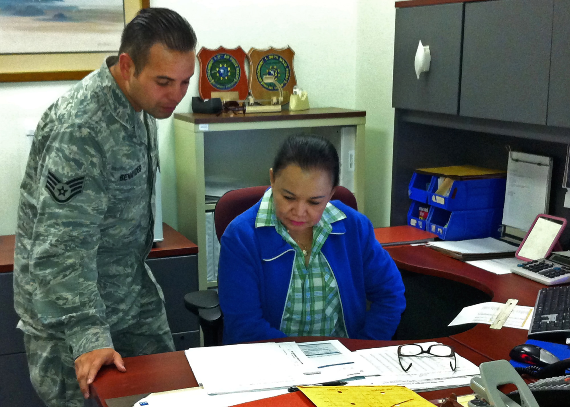 Staff Sgt. Ernest Benavides, 36th Mission Support Group Detachment 1 Materiel Management NCO in charge, and Elizabeth Del Pilar, 36th MSG Det. 1 budget analyst, review records at Diego Garcia May 1, 2013. Del Pilar has been the 36th MSG’s lone off-shore Philippine general schedule employee since 2004. (U.S. Air Force courtesy photo)