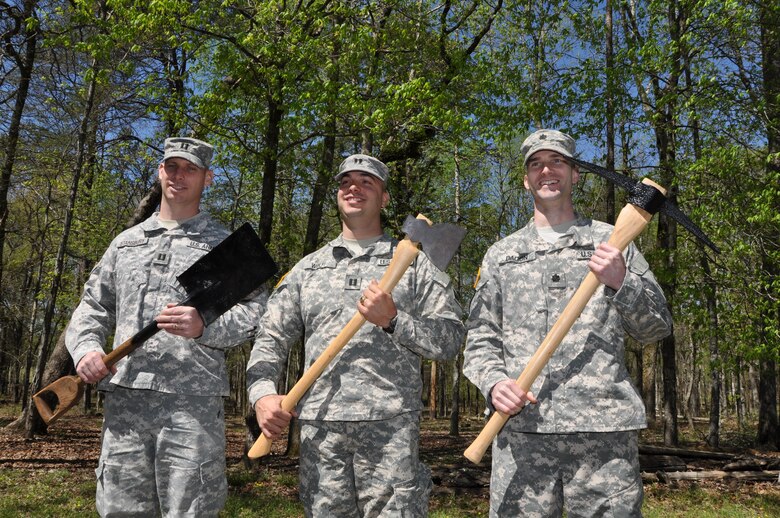 Members of the U.S. Army Corps of Engineers Nashville District hold Civil War tools of the engineers’ trade during a tour of the Chickamauga Battlefield April 12, 2013. From left: Capt. Allen Stansbury, , construction representative, Wolf Creek Dam Rehabilitation Project; Capt. Corey Wolff, project officer and quality assurance representative, Cheatham Lock and Resource Manager’s Building Project; and Lt. Col. Patrick Dagon, deputy district engineer. The shovel with wooden “D” handle at left is original, as well as the axe and pick, with reproduction handles, according to retired Army Lt. Col. Edwin L. Kennedy, Jr., ., assistant professor , Department of Command and Leadership at Redstone Arsenal, Ala., and tour guide. 