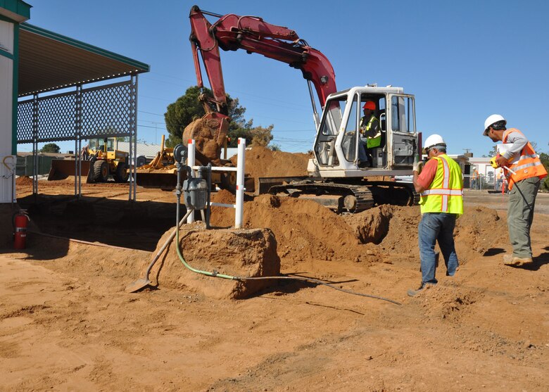 KINGMAN, Ariz. - Workers excavate soil around a home Apr. 19 during cleanup work being done by the US Army Corps of Engineers Los Angeles District at a Formerly Used Defense Site just outside Kingman, Ariz. The work being done by the District and its contractor, Eco & Associates, is part of the Time Critical Removal Action for the former Skeet Range, which is referred to as Munitions Response Site 03 of the former Kingman Ground-to-Ground Gunnery Range. 