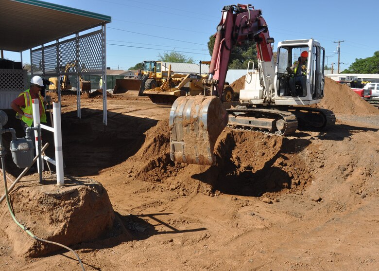 KINGMAN, Ariz. - Workers excavate soil around a home Apr. 19 during cleanup work being done by the US Army Corps of Engineers Los Angeles District at a Formerly Used Defense Site just outside Kingman, Ariz. The work being done by the District and its contractor, Eco & Associates, is part of the Time Critical Removal Action for the former Skeet Range, which is referred to as Munitions Response Site 03 of the former Kingman Ground-to-Ground Gunnery Range. 