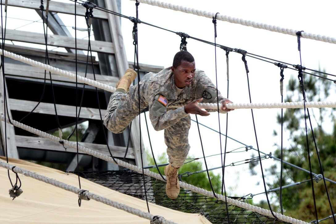 U.S. Army Spc. Garfield Ferdinand demonstrates his strength and endurance while completing Victory Tower and a skills competency course on Fort Jackson during the Region 3 Best Warrior Competition at the McCrady Training Center, Eastover, S.C., May 1, 2013. Ferdinand is assigned to the 651st Maintenance Company, Virgin Islands Army National Guard.
