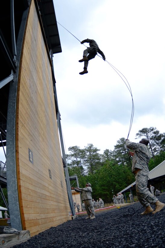 U.S. Army Spc. Carson Shelton demonstrates his strength and endurance while completing Victory Tower and a skills competency course on Fort Jackson during the Region 3 Best Warrior Competition at the McCrady Training Center, Eastover, S.C., May 1, 2013. Shelton is assigned to the 129th Area Support Medical Company, Alabama Army National Guard.