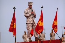 Lt. Gen. Kenneth J. Glueck Jr. speaks to Marines and sailors at Robert's Field on Camp Kinser May 6. Glueck spoke to Marines and sailors assigned to III Marine Expeditionary Force and Marine Corps Installations Pacific May 6-8 during an all-hands briefing about crises response, working alongside other nations, and reconstituting the MEF. Glueck is the commanding general of III Marine Expeditionary Force. The Marines and Sailors in attendance are with Combat Logistics Regiment 37, 3rd Marine Logistics Group, III MEF. 