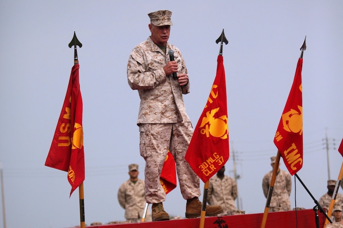 Lt. Gen. Kenneth J. Glueck Jr. speaks to Marines and sailors at Robert's Field on Camp Kinser May 6. Glueck spoke to Marines and sailors assigned to III Marine Expeditionary Force and Marine Corps Installations Pacific May 6-8 during an all-hands briefing about crises response, working alongside other nations, and reconstituting the MEF. Glueck is the commanding general of III Marine Expeditionary Force. The Marines and Sailors in attendance are with Combat Logistics Regiment 37, 3rd Marine Logistics Group, III MEF. 