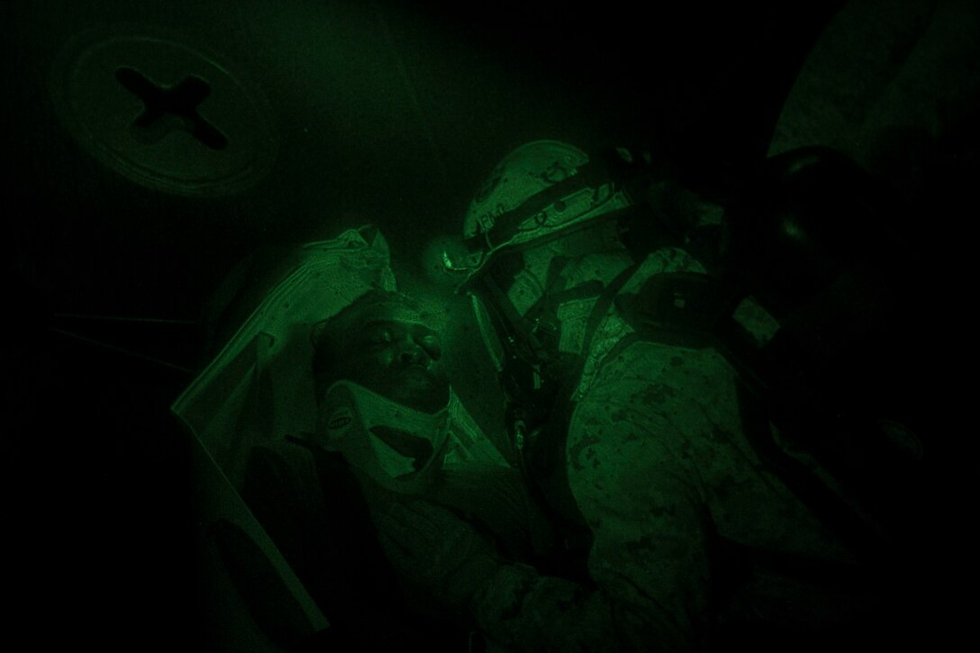 Chemical, biological, radiological and nuclear defense specialist U.S. Marines assigned to the 26th Marine Expeditionary Unit (MEU), check the condition of a simulated casualty during a confined space search and rescue exercise aboard the USS Kearsarge (LHD 3), at sea, May 9, 2013. The 26th MEU is deployed to the 5th Fleet area of operations aboard the Kearsarge Amphibious Ready Group. The 26th MEU operates continuously across the globe, providing the president and unified combatant commanders with a forward-deployed, sea-based quick reaction force. The MEU is a Marine Air-Ground Task Force capable of conducting amphibious operations, crisis response and limited contingency operations. (U.S. Marine Corps photograph by Cpl. Kyle N. Runnels/Released)