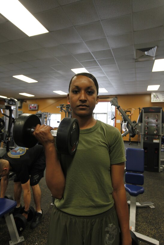 Lance Cpl. M. Diane Garcia, an administrative specialist with Marine Wing Headquarters Squadron 2, works out at the Devil Dog gym May 6. 