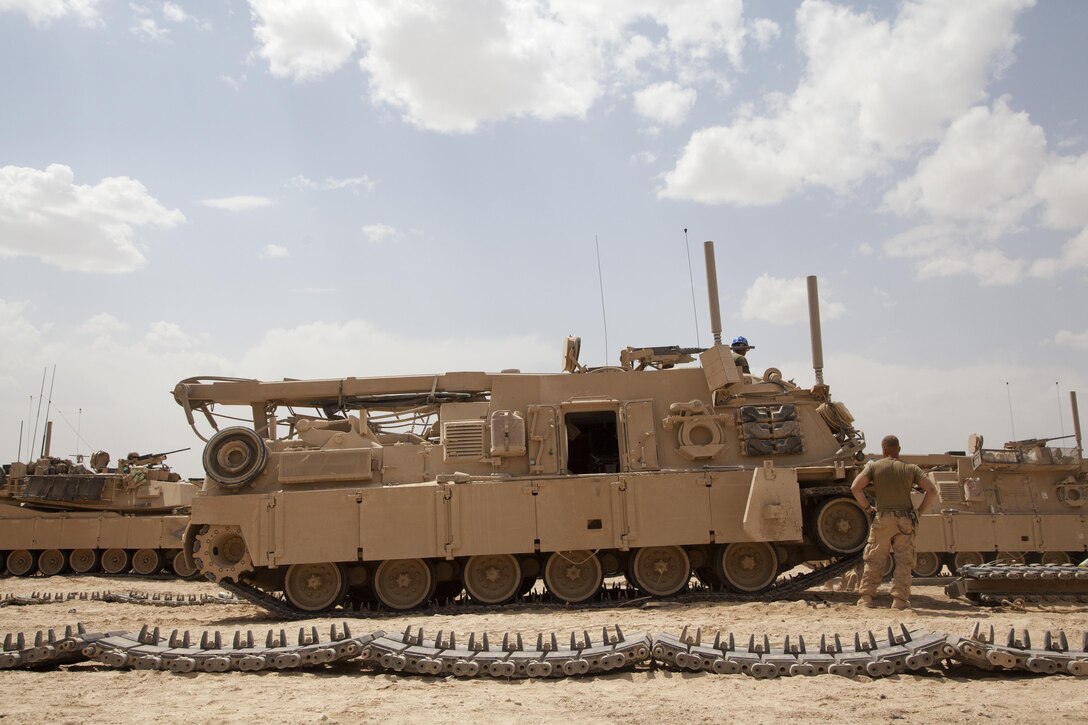 U.S. Marines assigned to Delta Company, 1st Tank Battalion, conduct routine maintenance on a M88A2 Hercules recovery vehicle on forward operating base Shir Ghazay, Helmand province, Afghanistan, May 7, 2013. The Marines replaced the tracks on the vehicle to ensure operational readiness. (U.S. Marine Corps photo by Cpl. Alejandro Pena/Released)