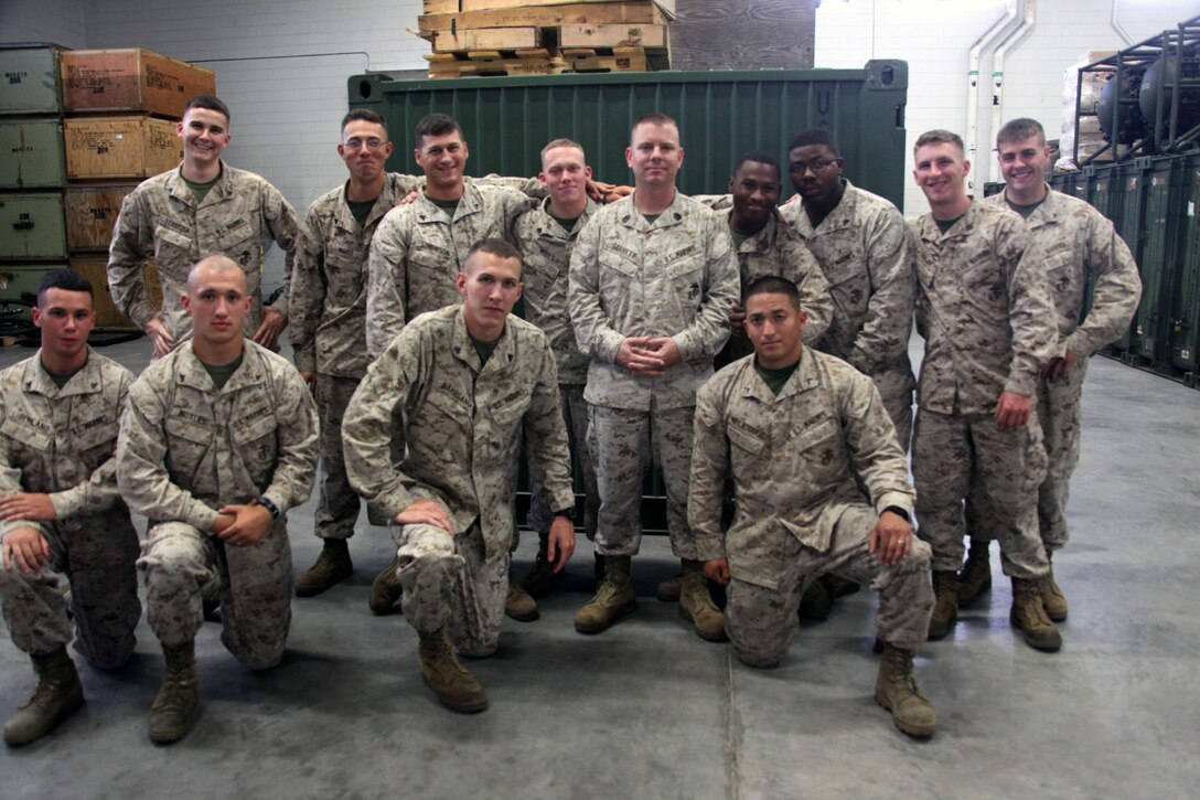Gunnery Sgt. Richard Garrett (center), fuels team leader with Marine Wing Support Squadron 273, is surrounded by Marines from his work
center aboard Marine Corps Air Station Beaufort, May 7. Marine Wing Support Squadron 273 received honors from the American Petroleum Institute
for contributions to Department of Defense bulk fuel operations, petroleum supply chain management, and fleet fuel support during 2012.