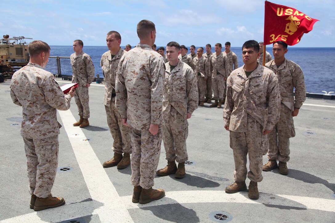 Marines assigned to Weapons Company, Battalion Landing Team 3/5, 15th Marine Expeditionary Unit,  are promoted to the rank of sergeant during a promotion ceremony aboard USS Rushmore, May 1. The 15th MEU is comprised of approximately 2,400 Marines and sailors and is deployed as part of the Peleliu Amphibious Ready Group. Together, they provide a forward-deployed, flexible sea-based Marine Air Ground Task Force capable of conducting a wide variety of operations ranging from humanitarian aid to combat. (U.S. Marine Corps photo by Cpl. Timothy Childers / Released)