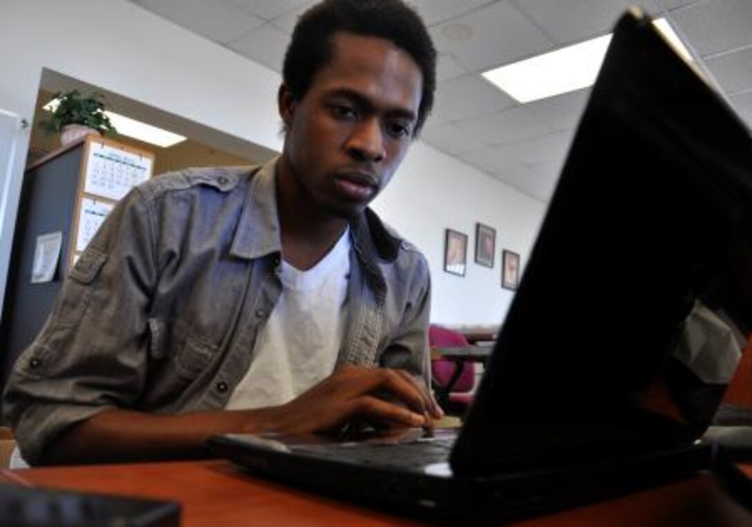 Seun Dodo-Williams, web administrator with Marine Corps Logistics Base Barstow works on the base's website.


