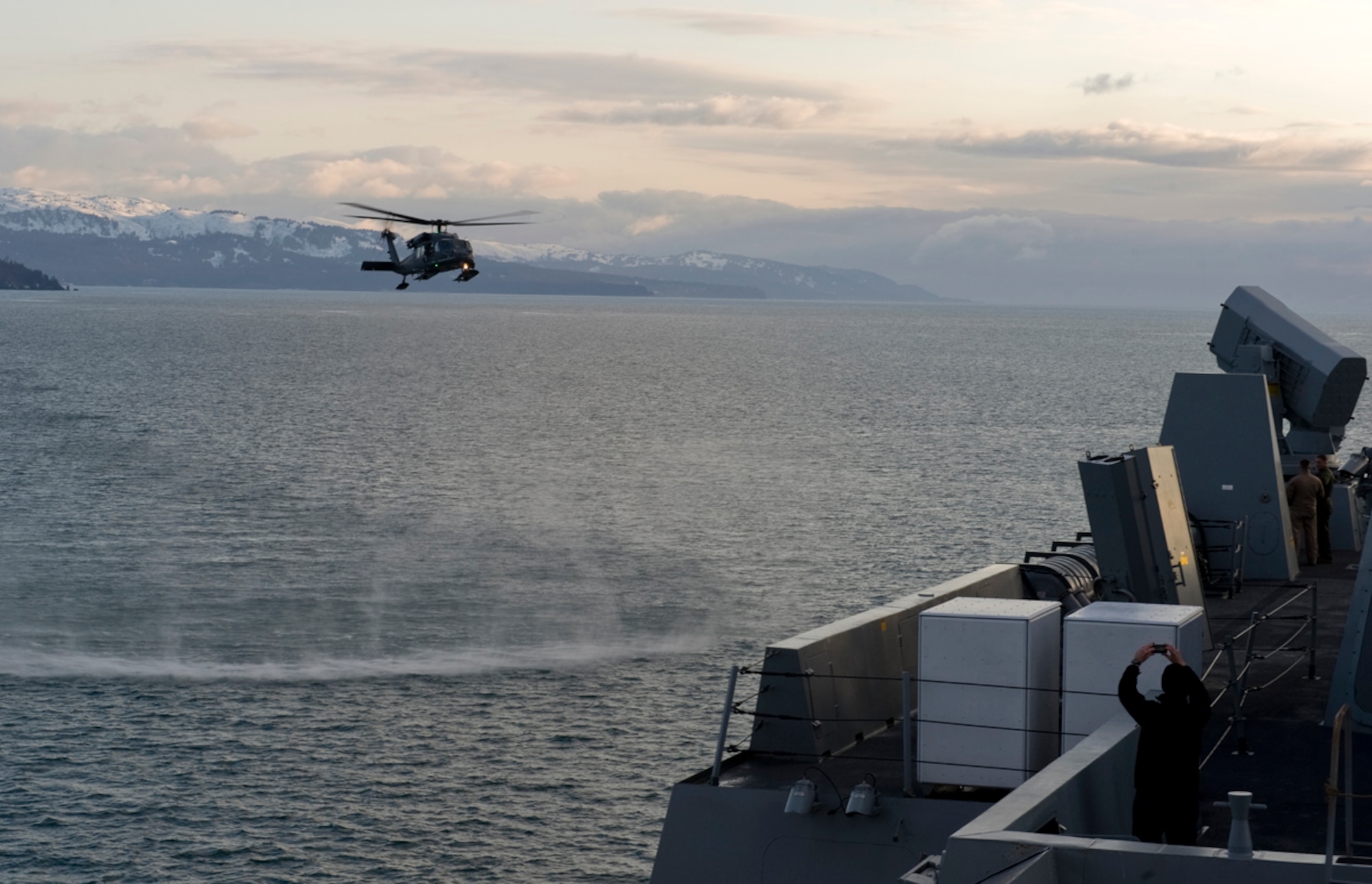 An Alaska Air National Guard HH-60 Pave Hawk combat search and rescue helicopter, from the 210th Rescue Squadron, prepares to land on the flight deck of the USS Anchorage, an amphibious landing craft, on Cook Inlet April 30, 2013. The Pave Hawk pilots practiced landing on the USS Anchorage to receive training not readily available in the region. The USS Anchorage came to the Port of Anchorage for a commissioning ceremony in the city it was named after. (U.S. Air Force photo/Staff Sgt. Zachary Wolf)