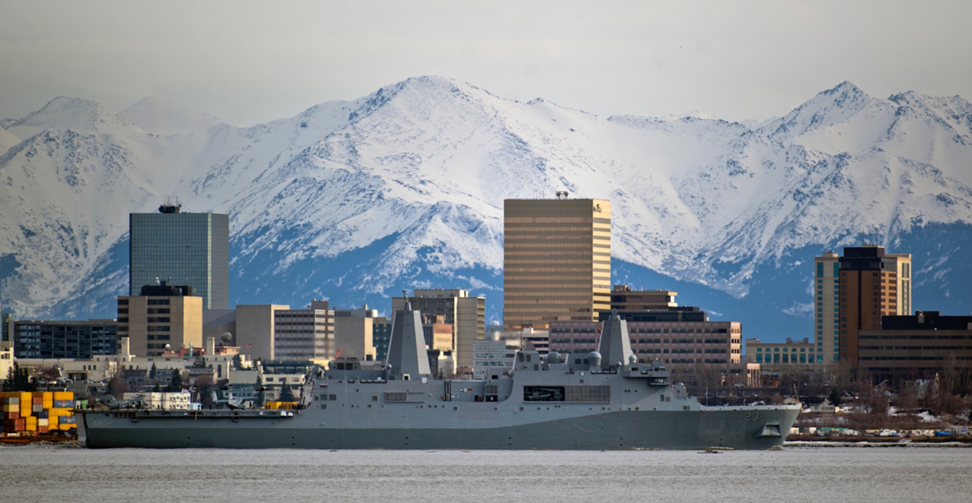 ANCHORAGE, Alaska -- The USS Anchorage (LPD-23), a San Antonio-class amphibious transport dock ship, is seen May 6, 2013, departing its namesake port of Anchorage, Alaska, framed by city's downtown and Chugach Mountain Range.  The vessel officially joined the U.S. Navy during a commissioning ceremony held at the port on May 4, and holds a complement of approximately 700 Sailors and Marines. (U.S. Air Force photo/Justin Connaher)
