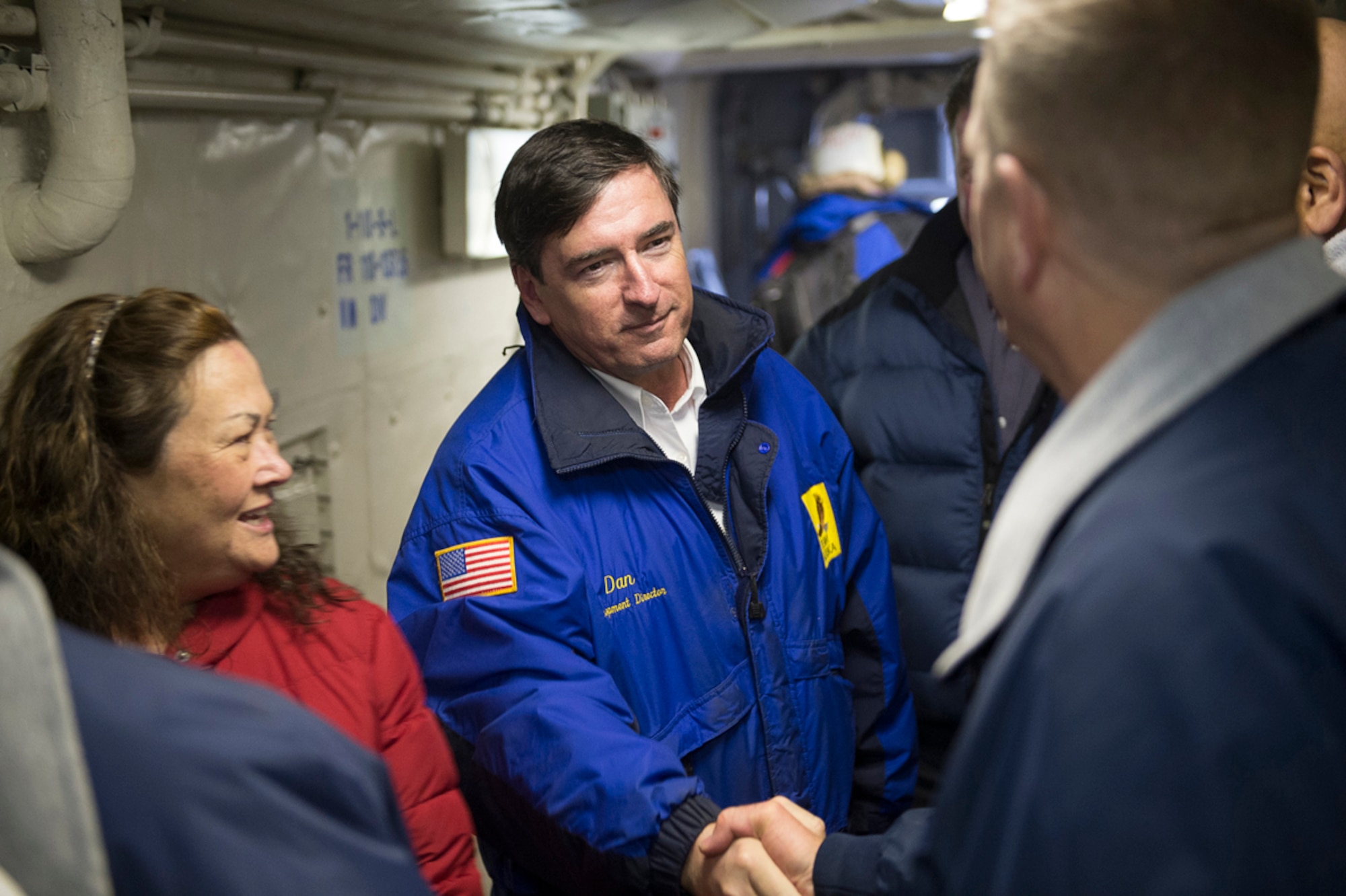 COOK INLET, Alaska -- Navy Cmdr. Joel Stewart, commanding officer of the the San Antonio-class amphibious transport dock ship Pre-Commissioning Unit (PCU) Anchorage (LPD 23), greets Anchorage Mayor Dan Sullivan April 30, 2013, as he arrives aboard the ship as the Anchorage approaches the coast of Alaska. Anchorage is en route to its namesake city of Anchorage, Alaska, for its commissioning ceremony May 4. (U.S. Navy photo/Petty Officer1st Class James R. Evans)