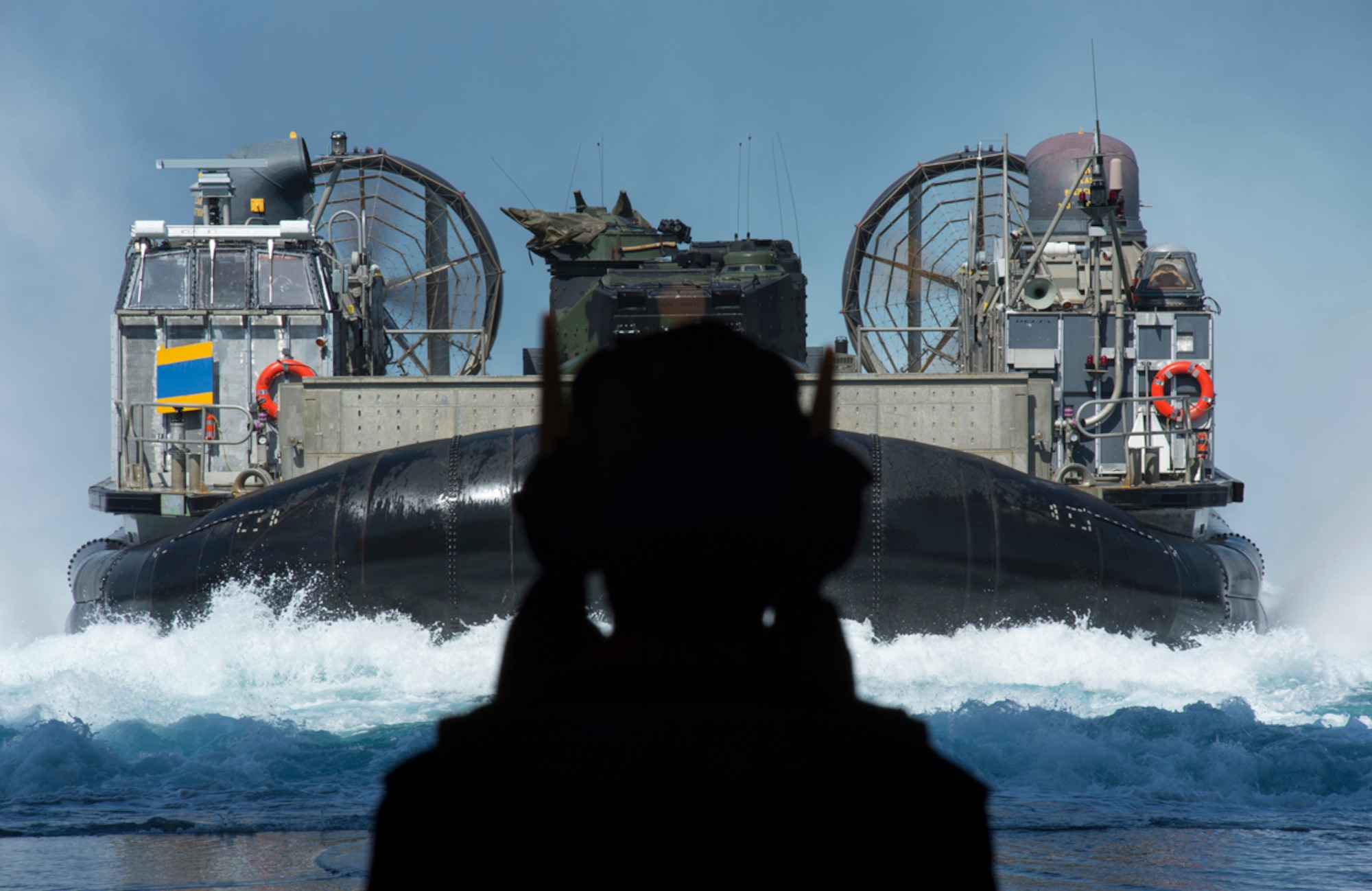 PACIFIC OCEAN (April 22, 2013) Deck department Sailors direct a landing craft air cushion (LCAC) into the well deck of the San Antonio-class amphibious transport dock ship Pre-Commissioning Unit (PCU) Anchorage (LPD 23). Anchorage is en route to its namesake city of Anchorage, Alaska, for its commissioning ceremony May 4. The LCAC is a high-speed, over-the-beach fully amphibious landing craft, capable of carrying a 60 to 75-ton payload. It is used to transport the weapons systems, equipment, cargo and personnel of the Marine Air-Ground Task Force from ship to shore. (U.S. Navy photo/Petty Officer 1st Class James R. Evans)
