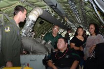 Airman 1st Class Kenneth D. Stricker, 96th Airlift Refueling Squadron boom operator, left, explains to Damon Hall-Kaneakua, center, and his family members how the auxiliary power unit on a KC-135 Stratotanker starts the jet engines with bleed air, while aboard a KC-135 on the flightline at Joint Base Pearl Harbor-Hickam, Hawaii, May 3, 2013. The Pilot for a Day program focuses on children who have serious or chronic conditions, with the goal of giving each child a special day and a break from whatever challenges they may face. (U.S. Air Force photo/Tech. Sgt. Phyllis E. Keith)