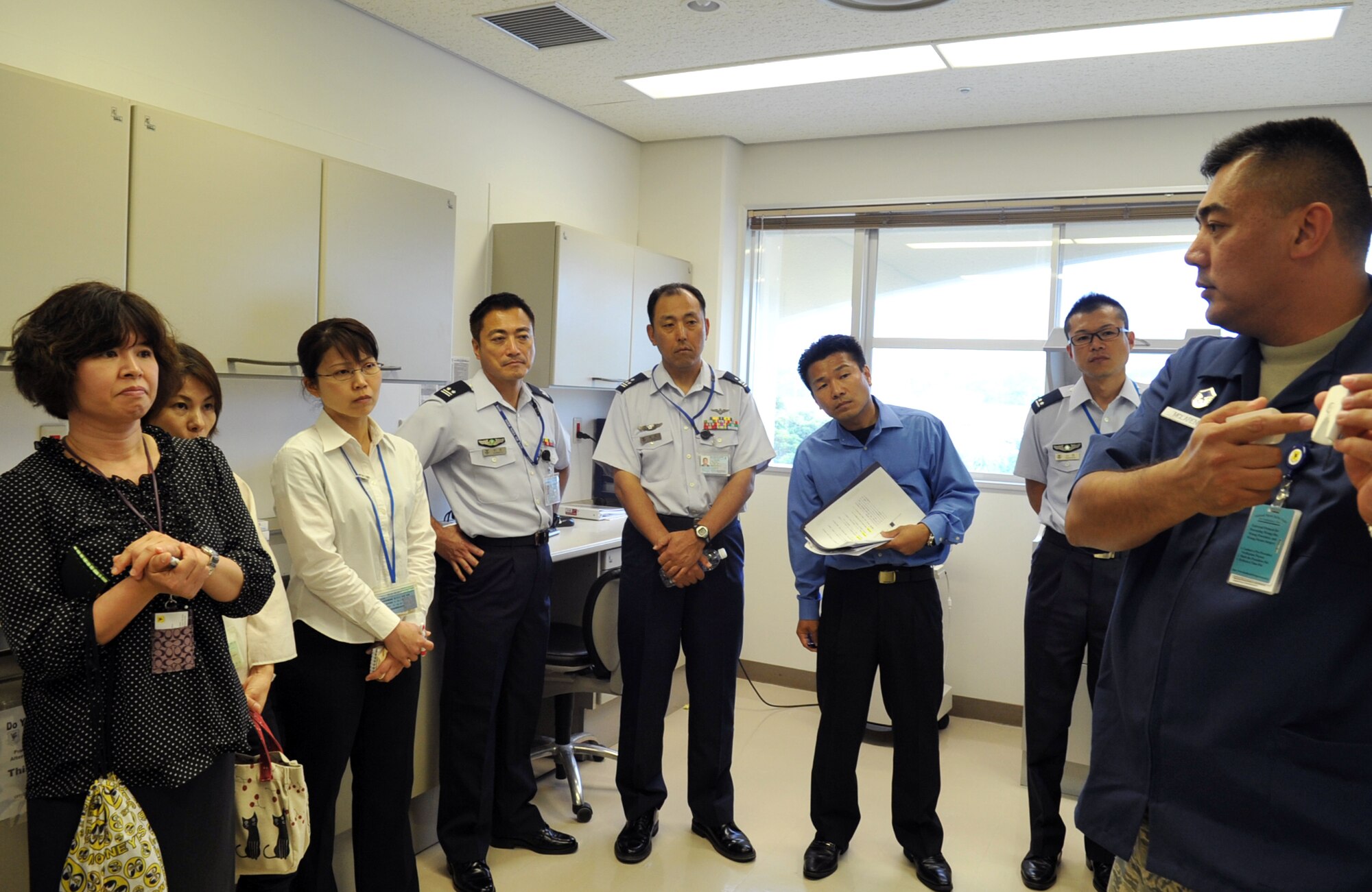 U.S. Air Force Master Sgt. Jay McLaren, 18th Dental Squadron dental lab technician, explains how to construct a dental crown to the Japan Air Self Defense Force medical staff during a visit to the 18th Medical Group on Kadena Air Base, Japan, May 7, 2013. Divided into two groups, the Japanese medical staff visited several sectors of the squadron such as the area dental laboratory, the aeromedical staging flight, and the medical laboratory and neonatal intensive care unit. (U.S. Air Force photo by Naoto Anazawa/Released)
 
