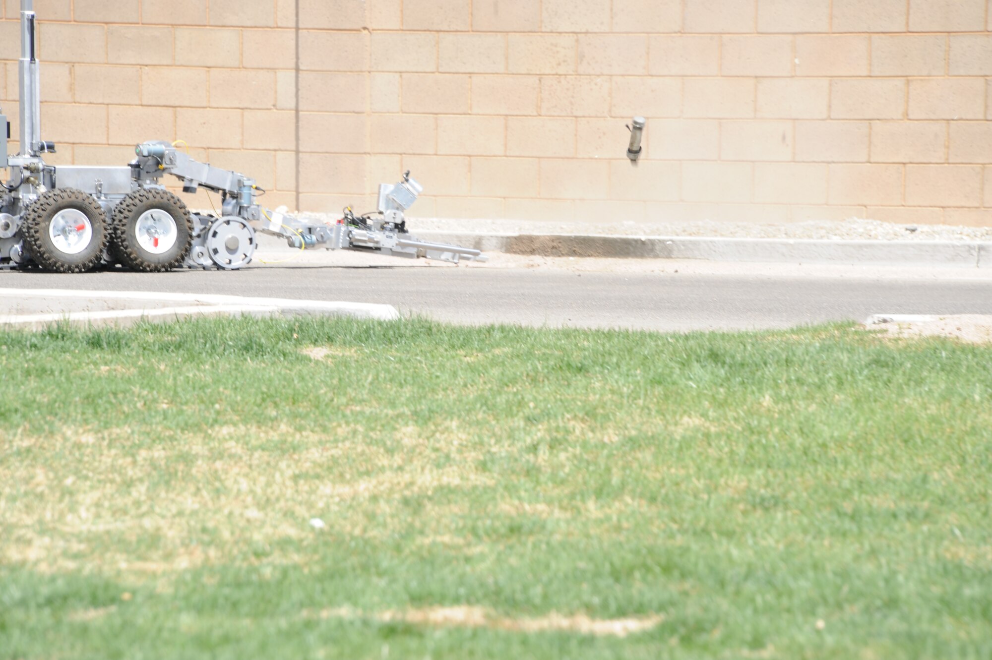 A three-member team of Airmen assigned to the 377th Explosive Ordnance Disposal Flight at Kirtland Air Force Base performed an exercise April 30 as part of the process to certify an EOD technician in team-leader upgrade training. One of the team’s tasks was to operate a radio-controlled robot to disarm a simulated improvised explosive device. 